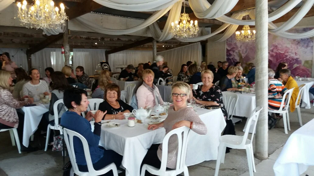 55 lovely ladies enjoying the High Tea