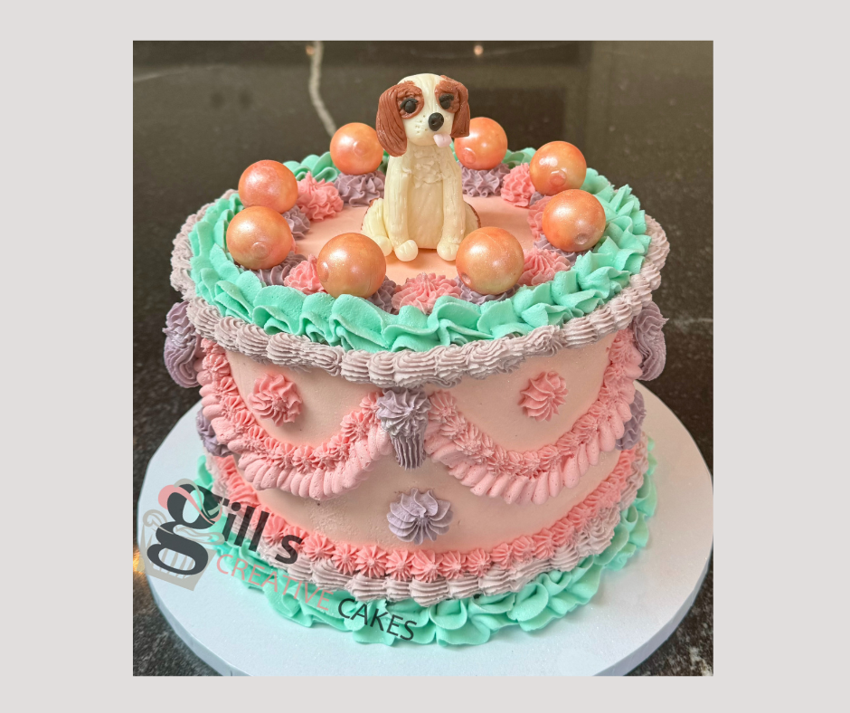Lambeth style birthday cake with family King Charles spaniel.png