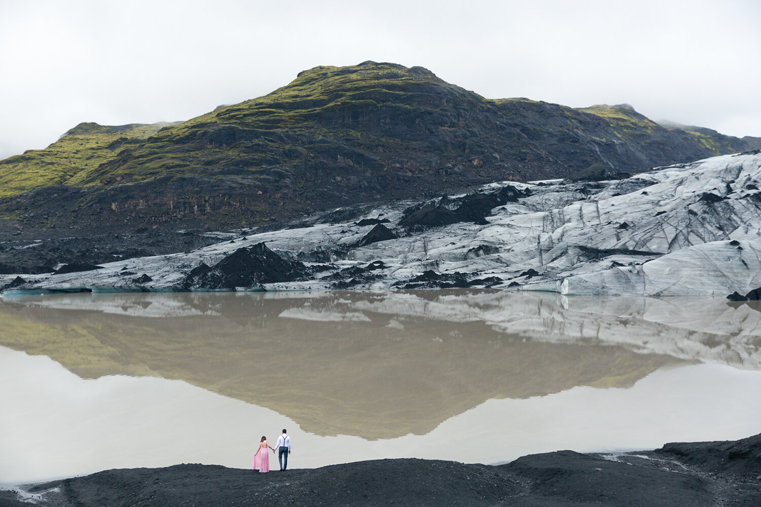 Iceland pre-wedding photographer. Drone pre-wedding photography next to a glacier at Solheimajokull in Iceland.