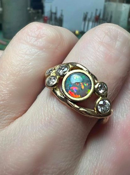 22ct gold from a bangle and Lighting Ridge Black Opal with white diamonds from unworn pieces.