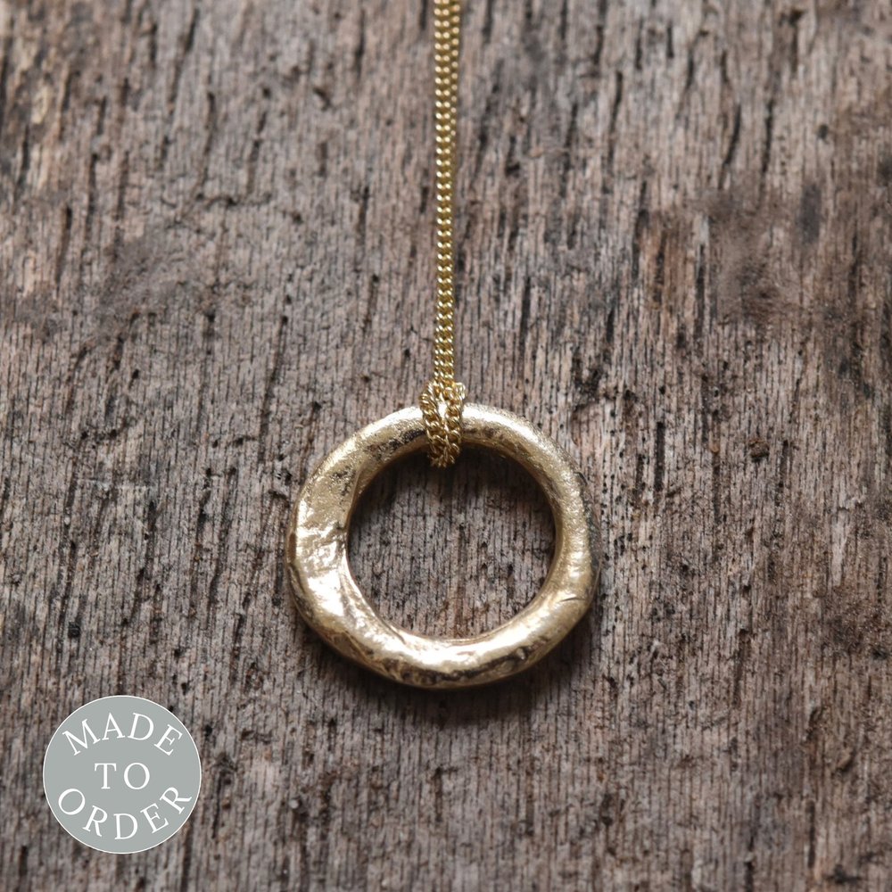 Organic molten textured gold circle pendant necklace handmade from