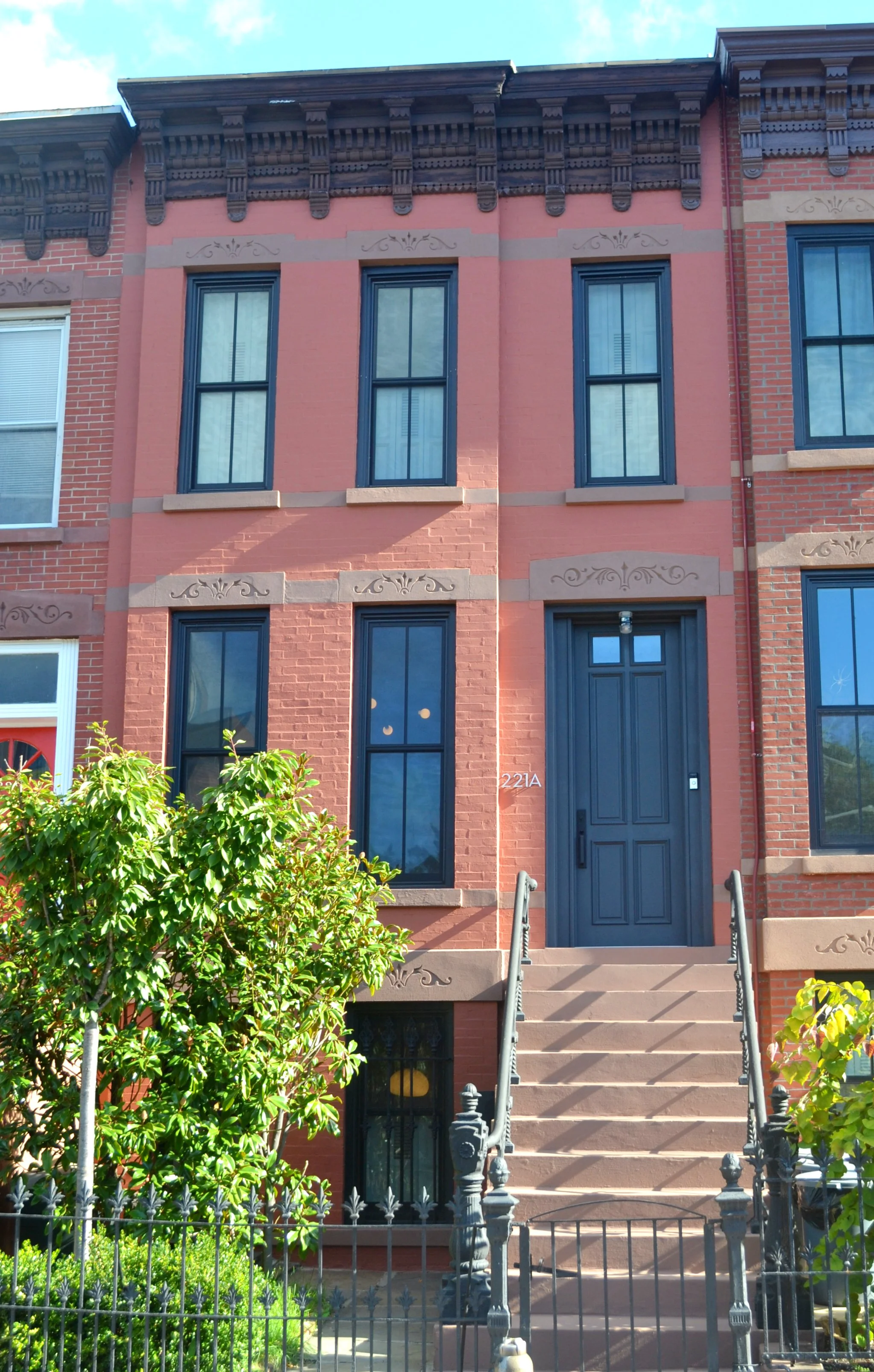  we added historically correct windows, with laminated glass to mitigate the road noise, and designed a full height front door, and restored all the brownstone. 