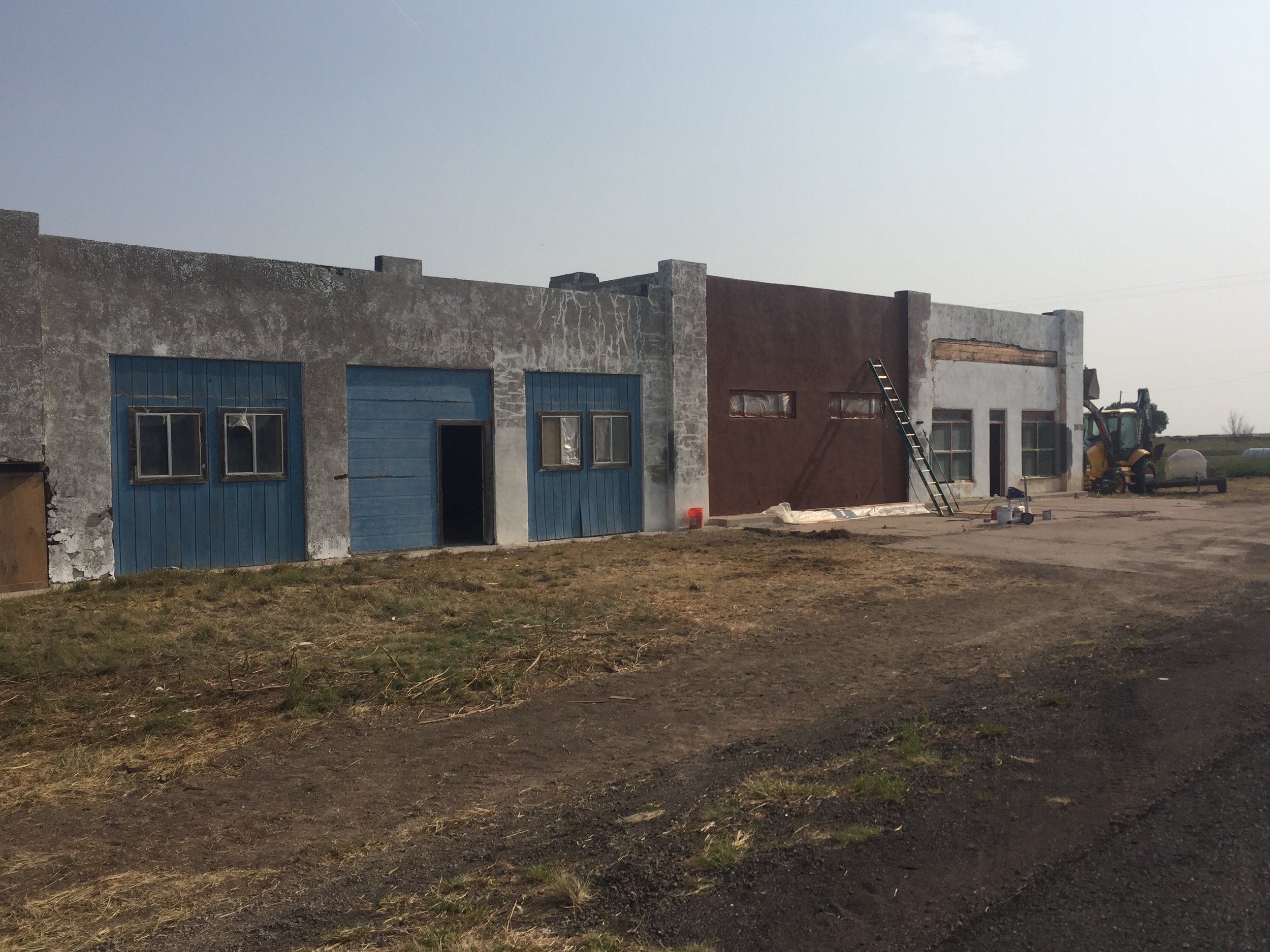  The design of this building has changed a couple times through the years. The original stone building was built and then sawn in half lengthwise when the highway was widened. At that time, in order to maintain a shop space they framed in and built t