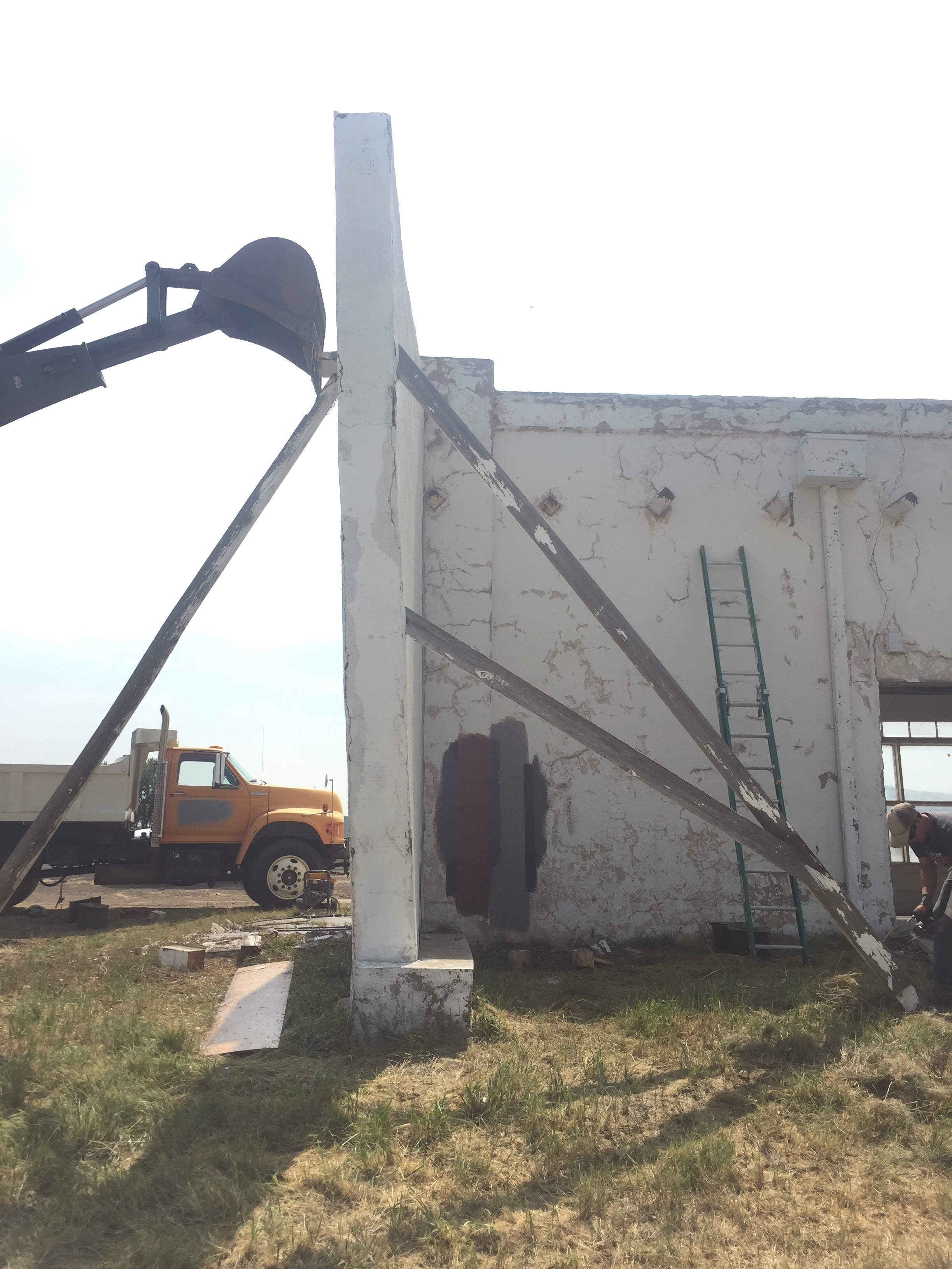  This facade was added in order to give the building a look of similar dimension when they cut it down. It was leaning pretty good so we straightened it up with the help of some equipment.  