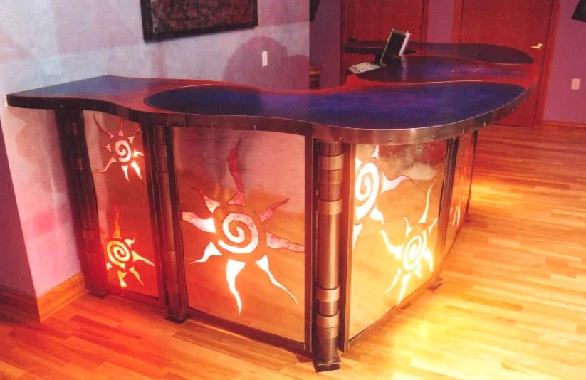  One of the first big pieces of furniture I created. This is made up of over 100 pieces of both mild and galvanized sheet steel, concrete, multiple light sources and colored papers. I never had a chance to weigh it. I would estimate it at 3,000 lbs !