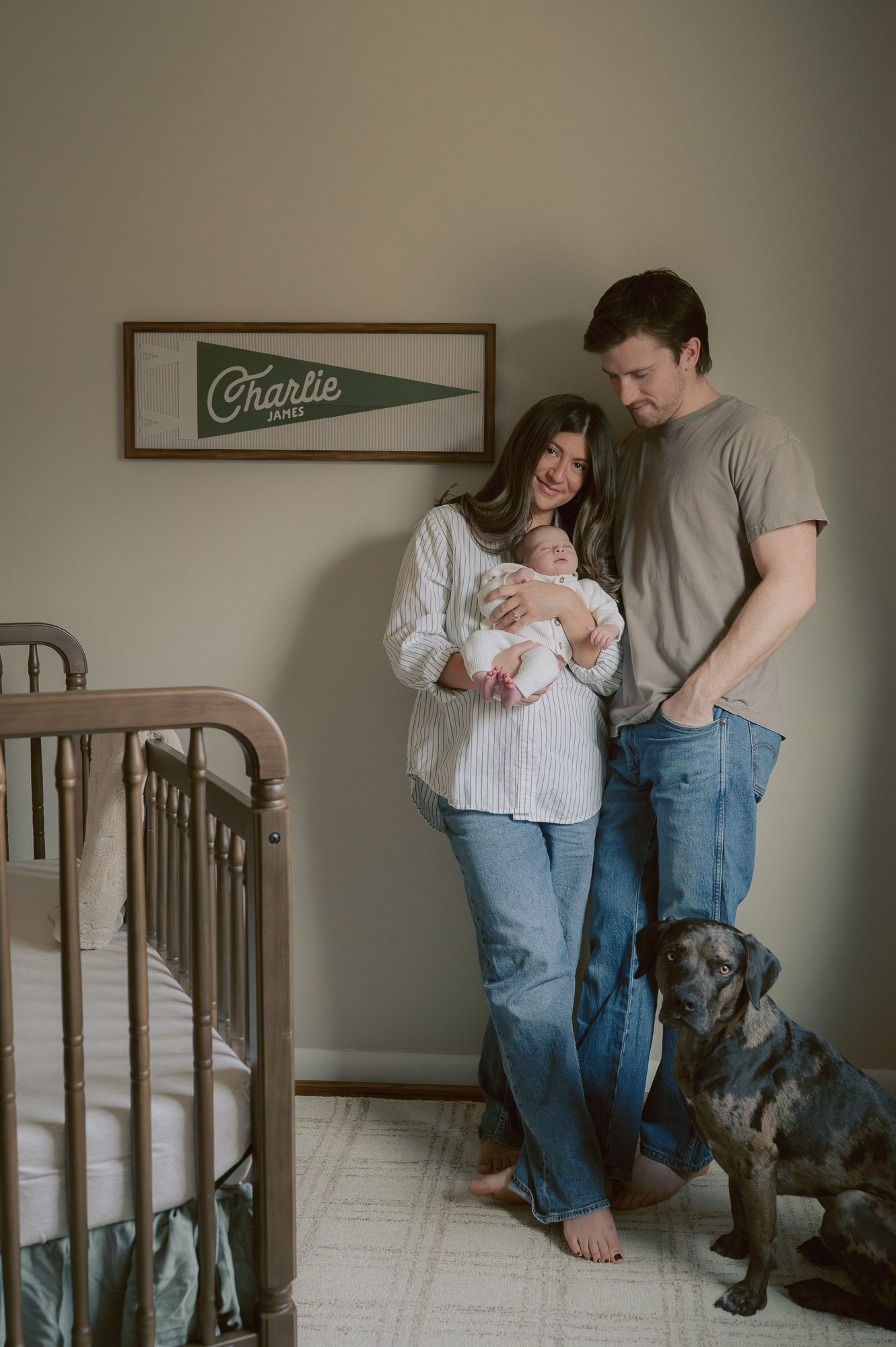 Parents with newborn baby during a family in-home session in Potomac Maryland