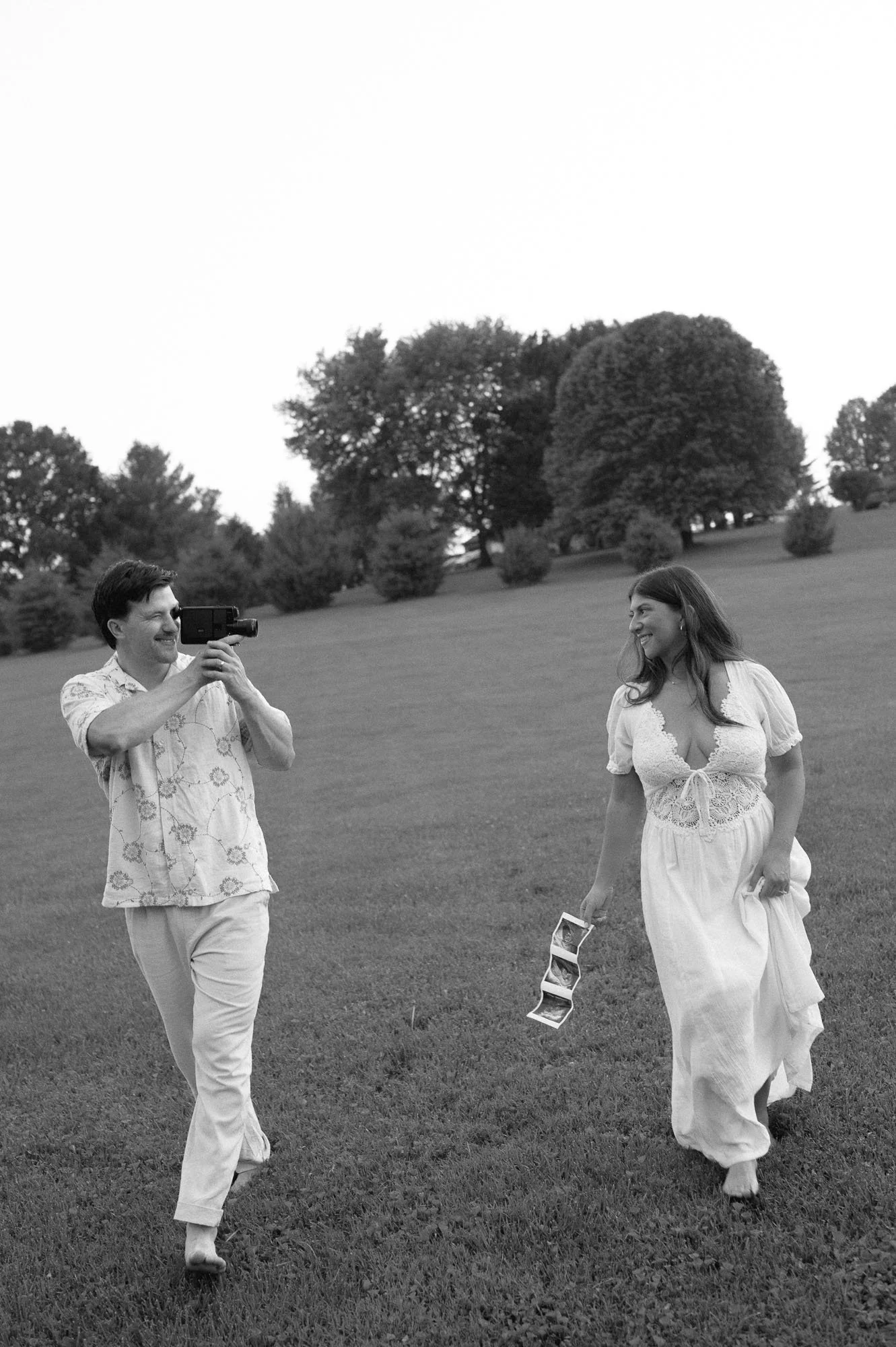 Couple posing in a maternity photoshoot for a gender reveal in Rhode Island