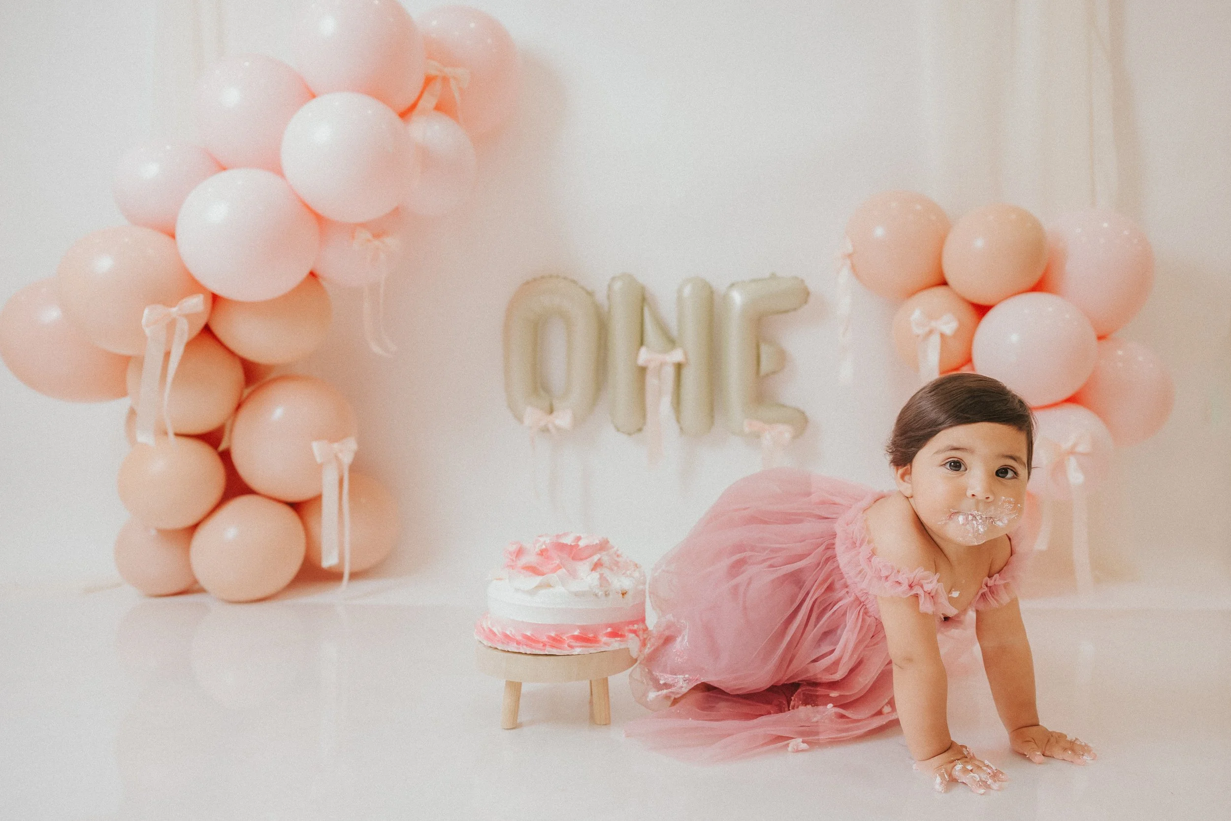 baby girl bow pastel neutral cake smash-12.jpg