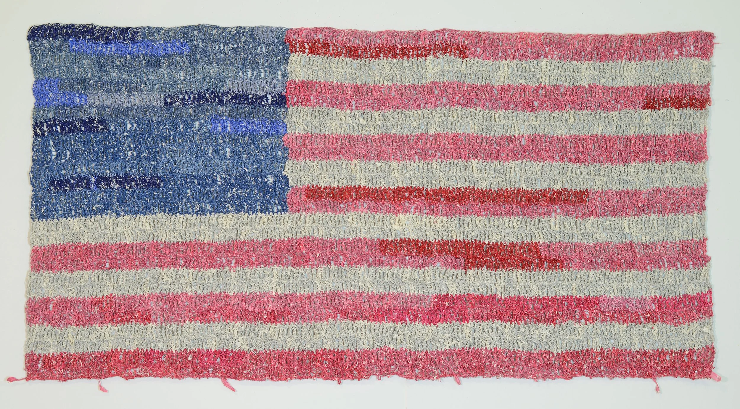    One Nation  , 2024  Crocheted paper from pages of constitutional law treatise (41, 246 inches of paper thread made and used)  37 x 64 inches (framed)  Available through  Contessa Gallery    