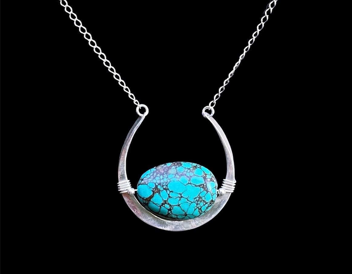 Turquoise Moon Portal Amulet in Sterling Silver 🌙 🌚 ✨

 &ldquo;Turquoise is perhaps the oldest stone in man&rsquo;s history, the talisman of royalty, shamans, and warriors. It is a stone of protection, strong and opaque, yet soothing to the touch, 