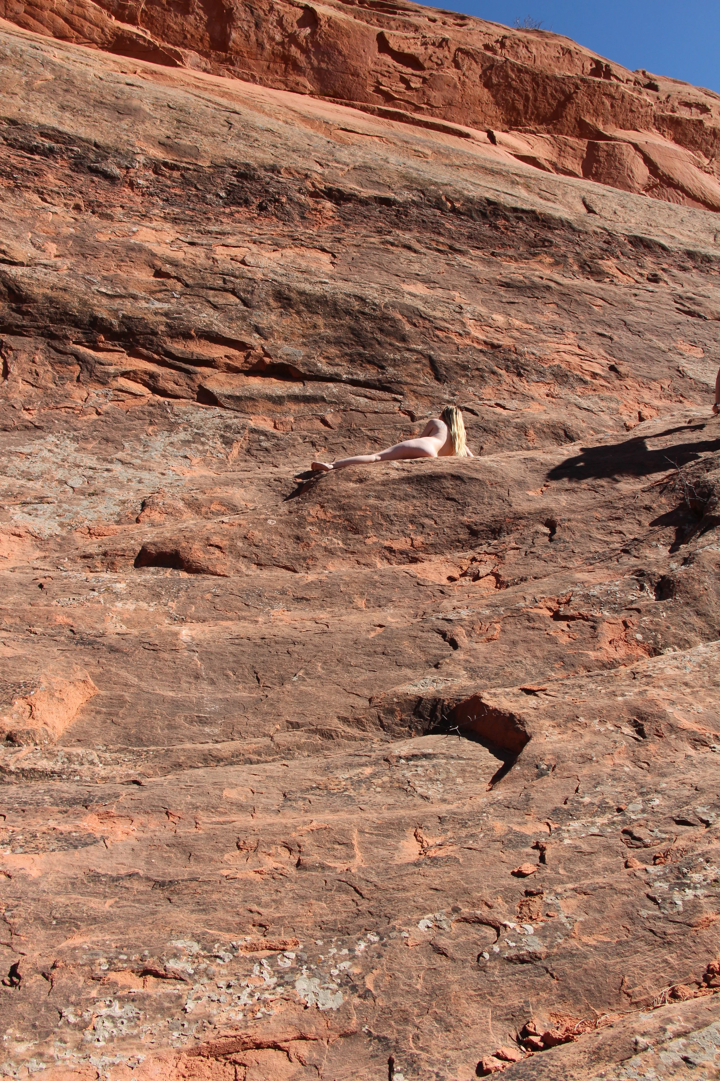 ZAli Redrocks lying down distant.JPG