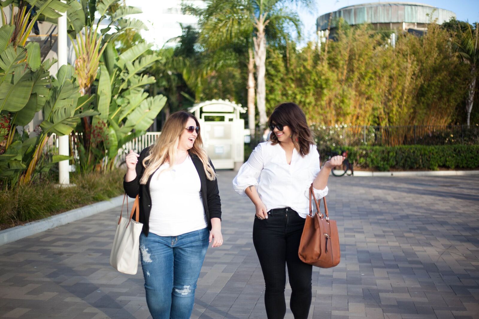 Allie and Kendra walking with purses.jpeg