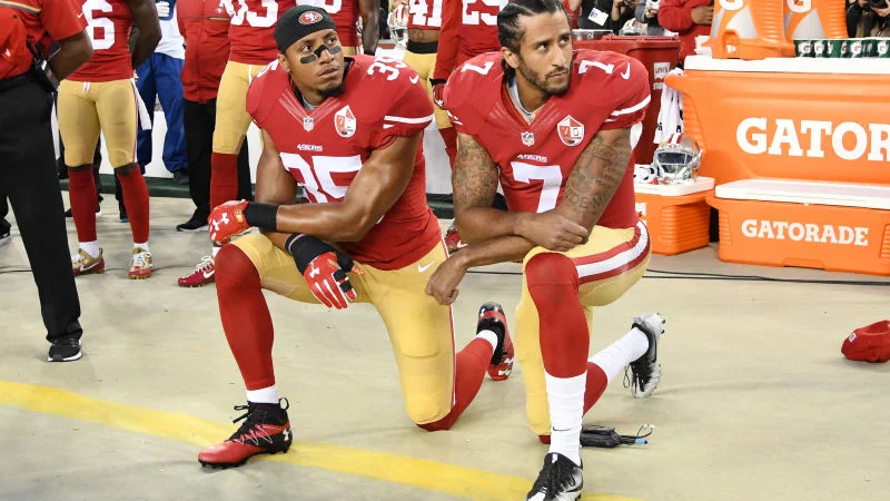 Eric Reid and Colin Kaepernick kneel during the National Anthem before a game against the Los Angeles Rams on September 12, 2016.