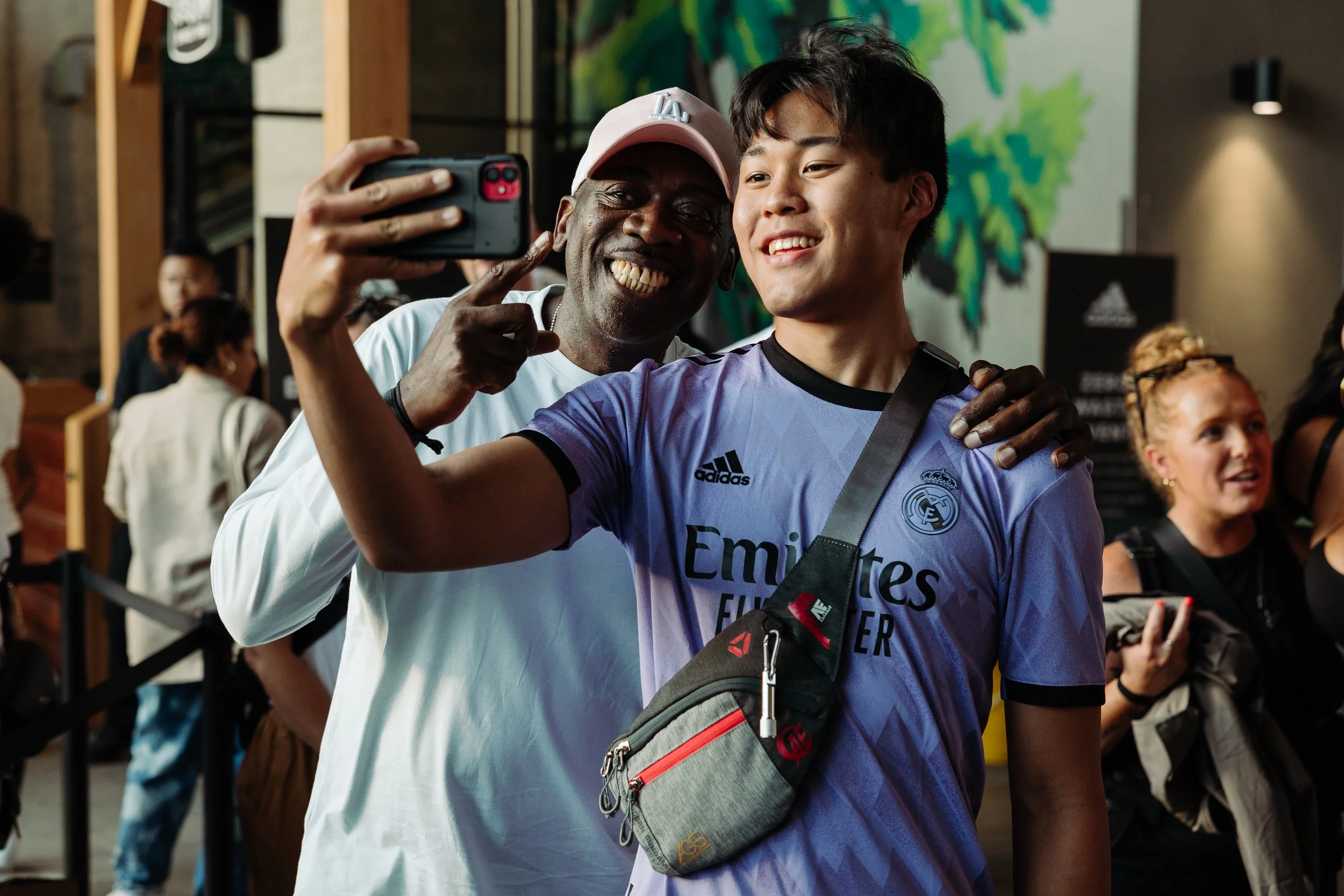 two people pose for a selfie at a corporate event in Portland Oregon