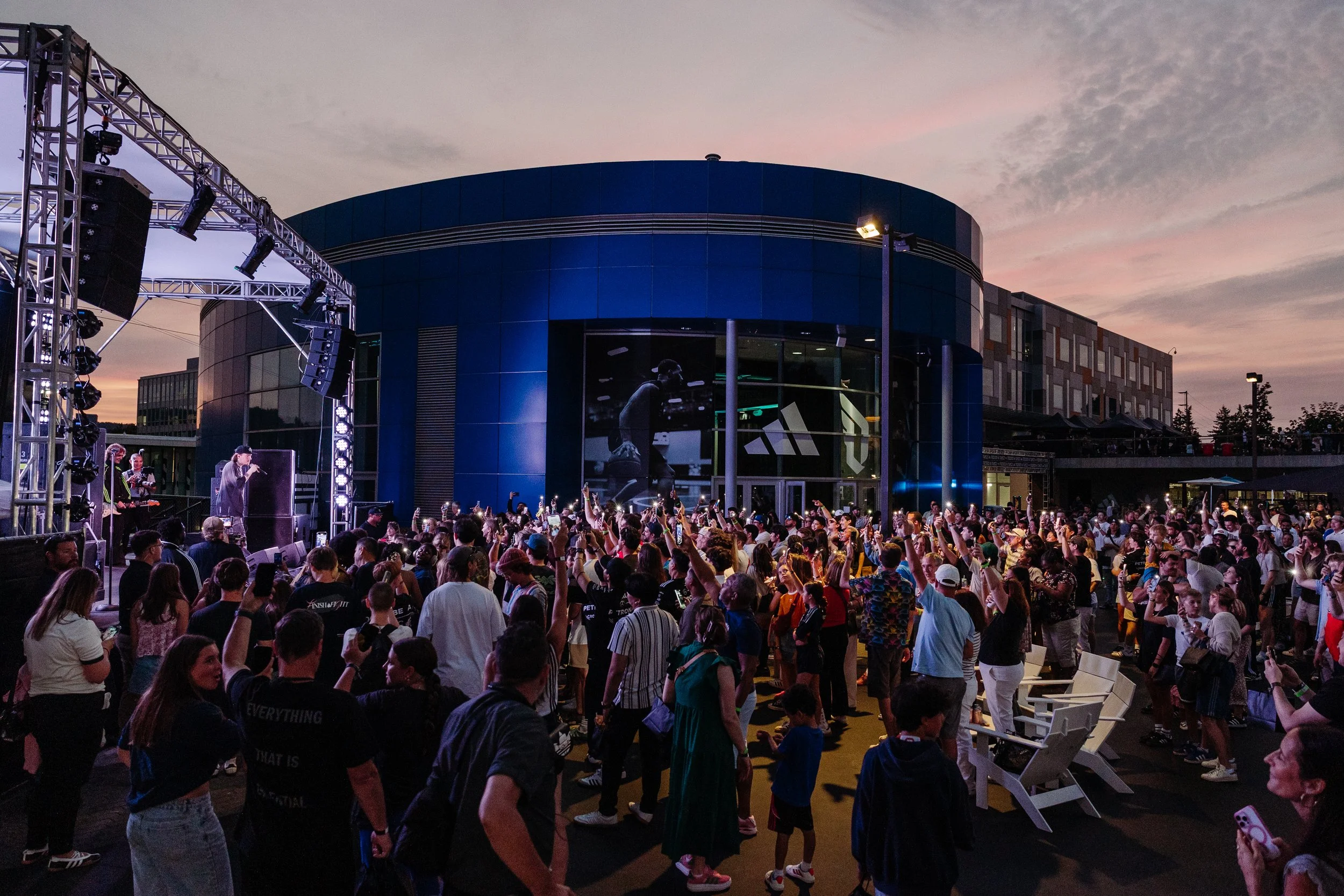 crowd gathers at corporate family and friends event at adidas headquarters