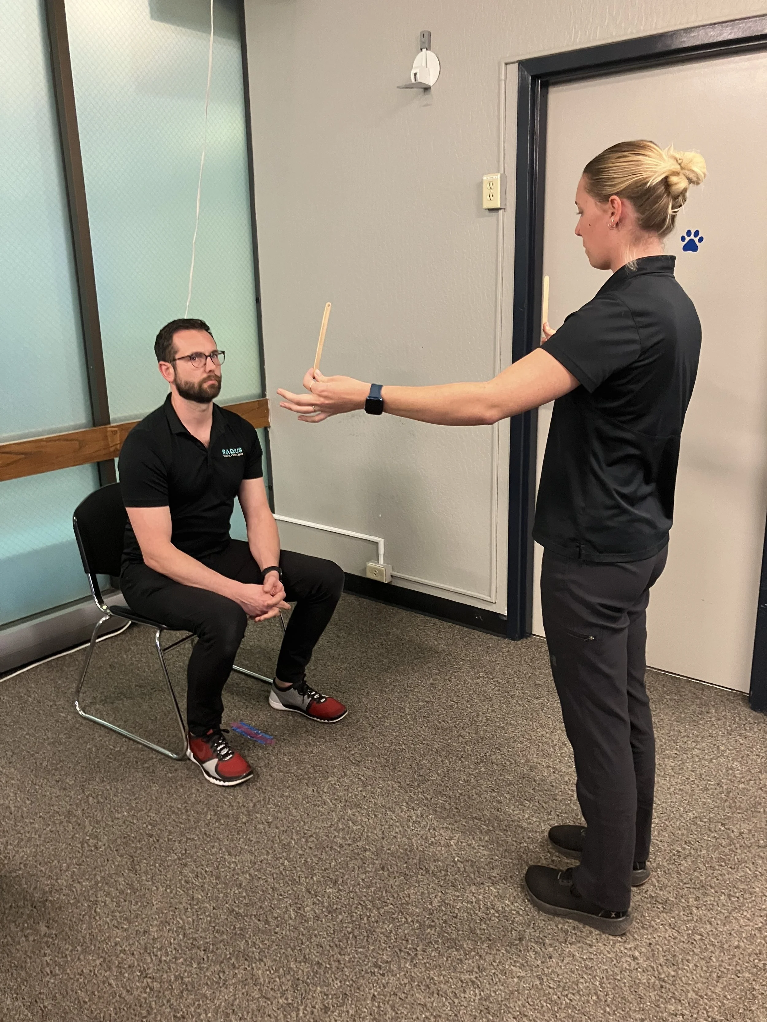 Vestibular and vision testing during a concussion evaluation at Radius Physical + Sports Rehab in Nevada City, CA.