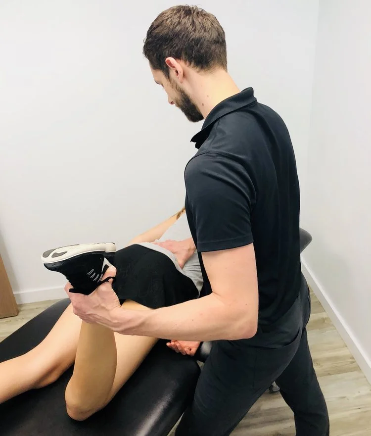 Provider performing knee joint mobilization and manual therapy to restore motion and reduce pain at Radius Physical + Sports Rehab in Nevada City, CA.