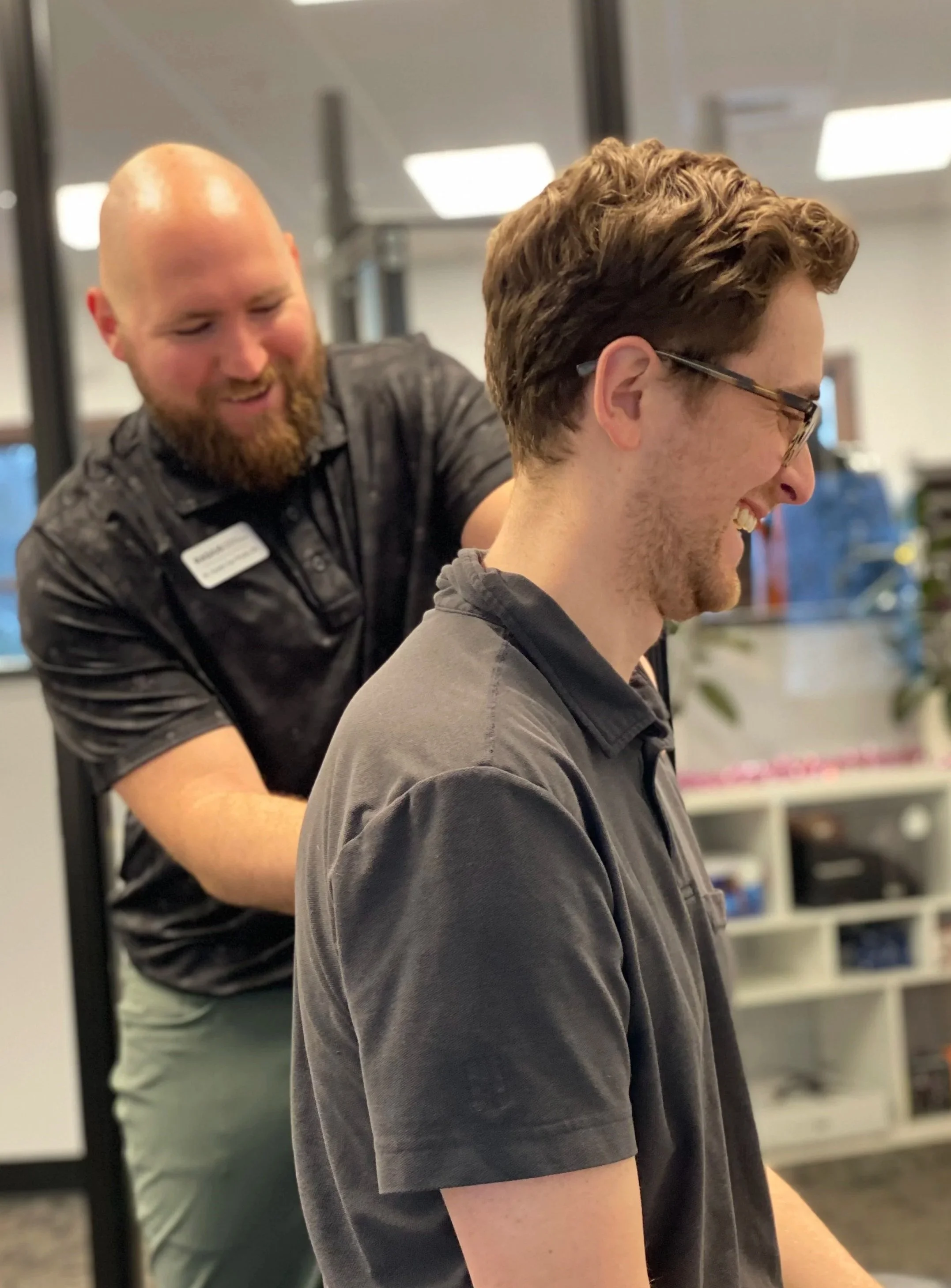 Chiropractor providing shoulder and upper back manual therapy for shoulder impingement treatment at Radius Physical + Sports Rehab in Nevada City, CA.