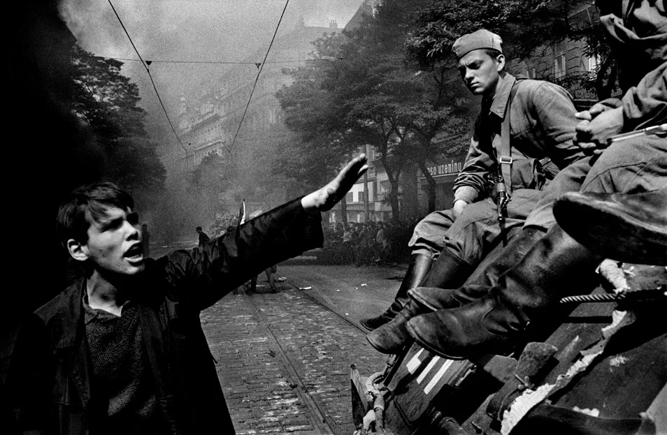 A young Czech man rebukes Soviet Soldiers.
