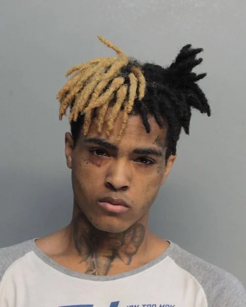 XXXtentaction mugshot following the arrest for his assault on his girlfriend