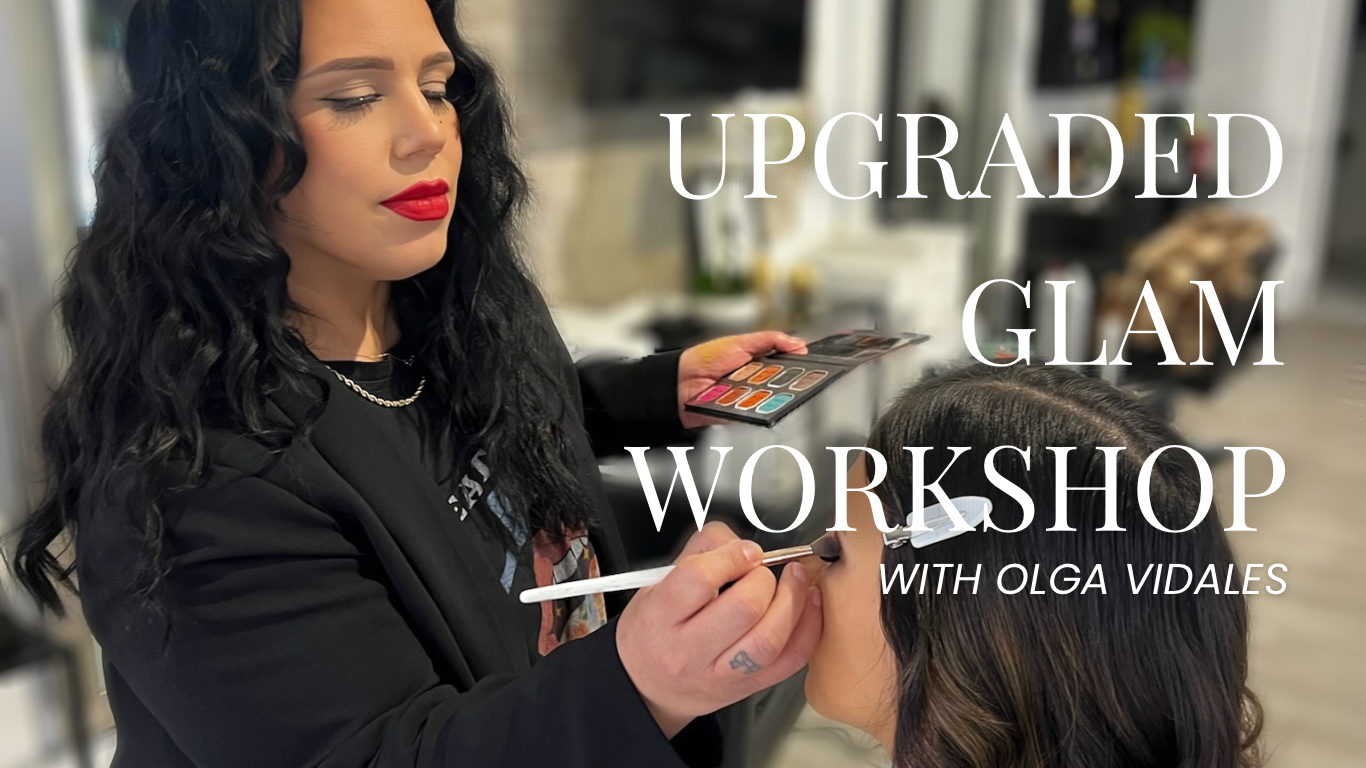 Beauty professional applying makeup to a woman in a salon, holding a makeup palette, with the text 'Upgraded Glam Workshop with Olga Vidales' overlayed.