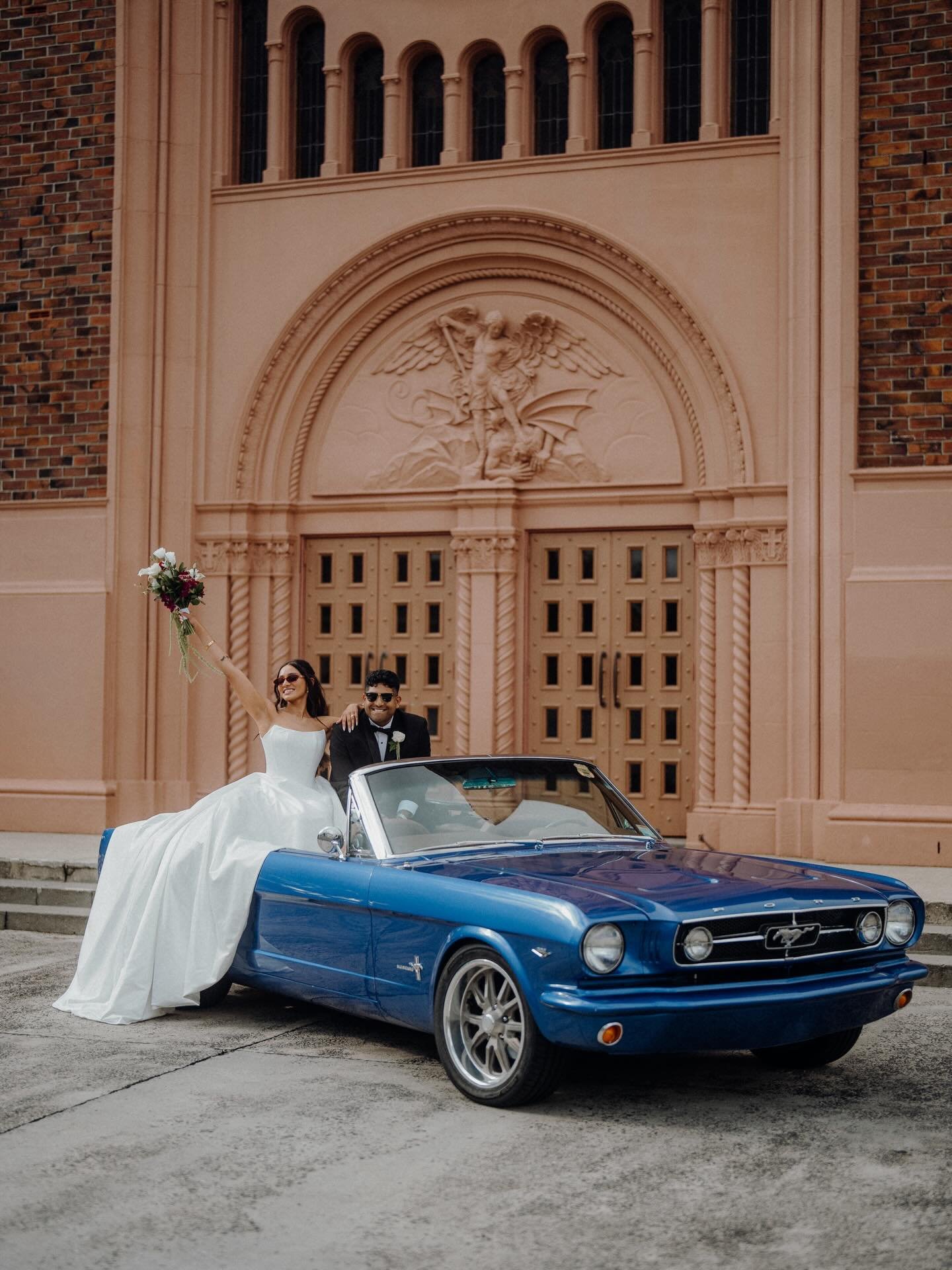 Congratulations, Karen &amp; Basil you did it! 🥹❤️ Rolling out in style in their vintage convertible Mustang, these two set the tone from the very start. The ceremony took place at Saint Michael Parish in Remuera, Auckland, followed by an epic recep