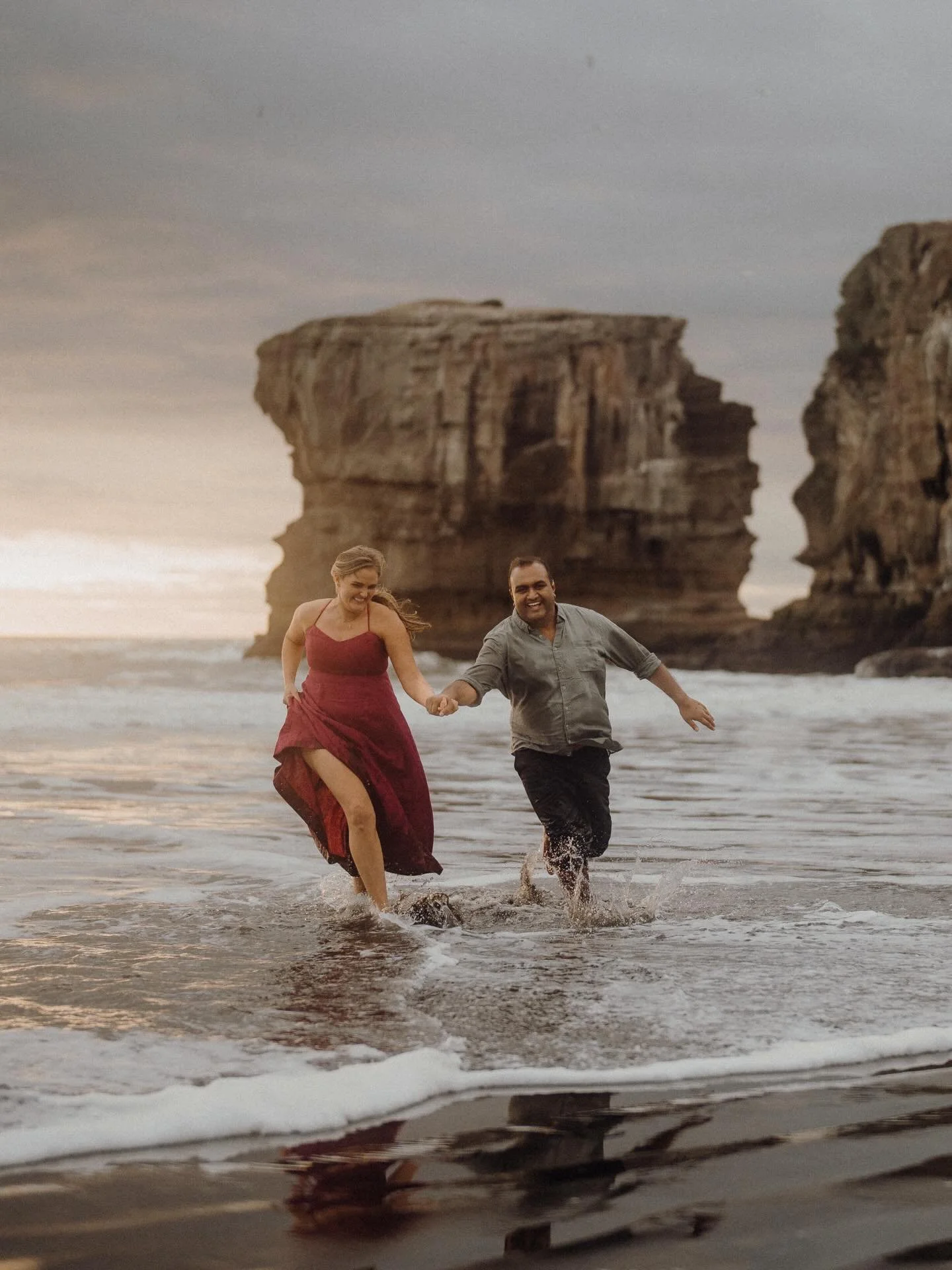 Xanthe &amp; Sajid 🤎 What a day this was. We started at the Winter Gardens with Sajid&rsquo;s family for some portraits surrounded by flowers, warmth, and the best energy. Then as the sun started to set, we headed out to Muriwai, where the cyclone h