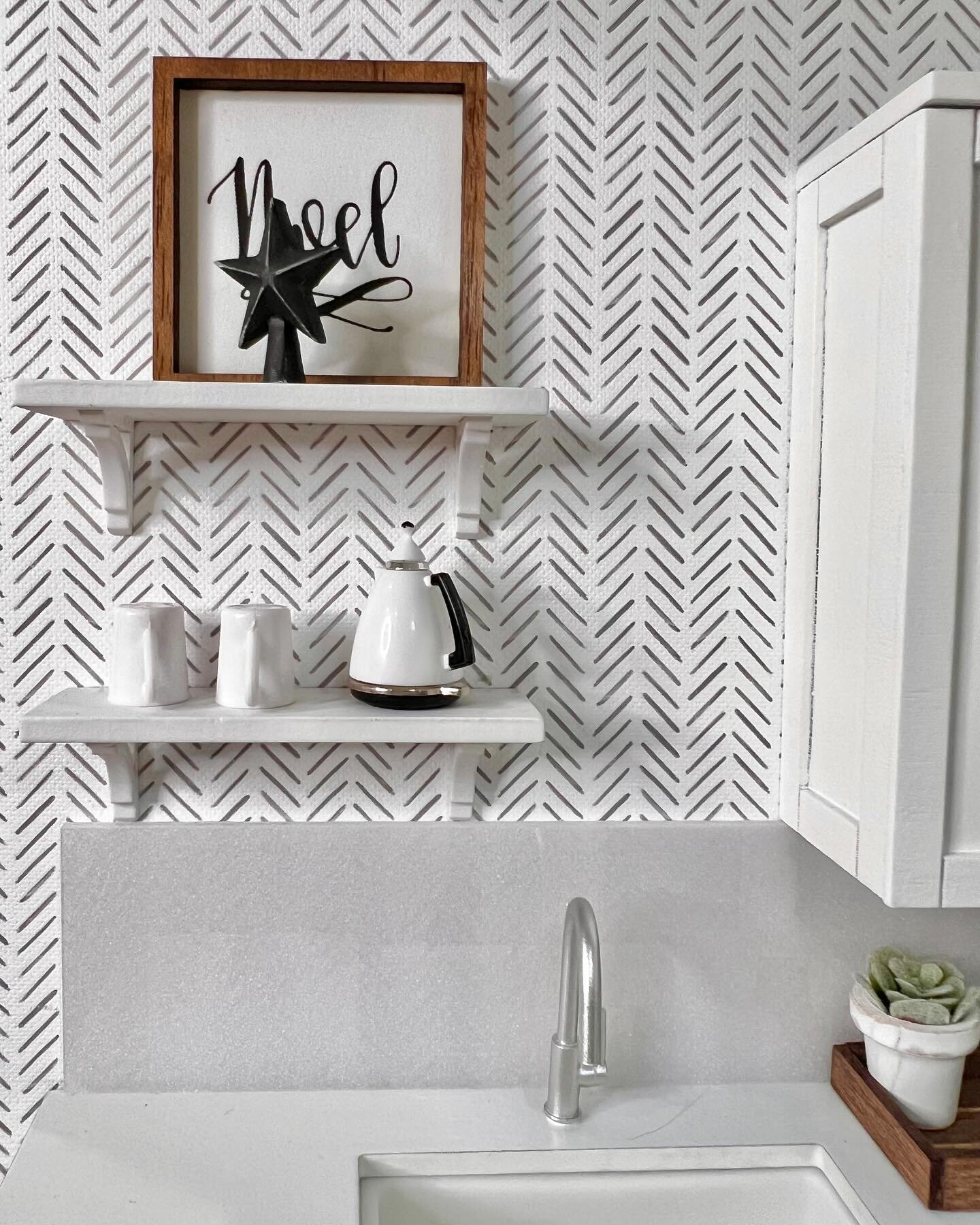 These shelves over the sink were the perfect spot for a coffee pot and mugs. 🫖☕️☕️

But I kid you not, no fewer than three times did we find that our 11-year-old had removed the tiny tree topper from its spot on the top shelf and placed it atop the 