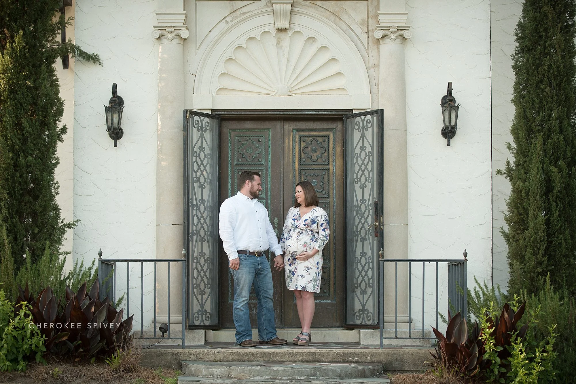 Springdale is the setting for this maternity photo shoot. The couple is framed by the fabulous brass doors of the front entrance.