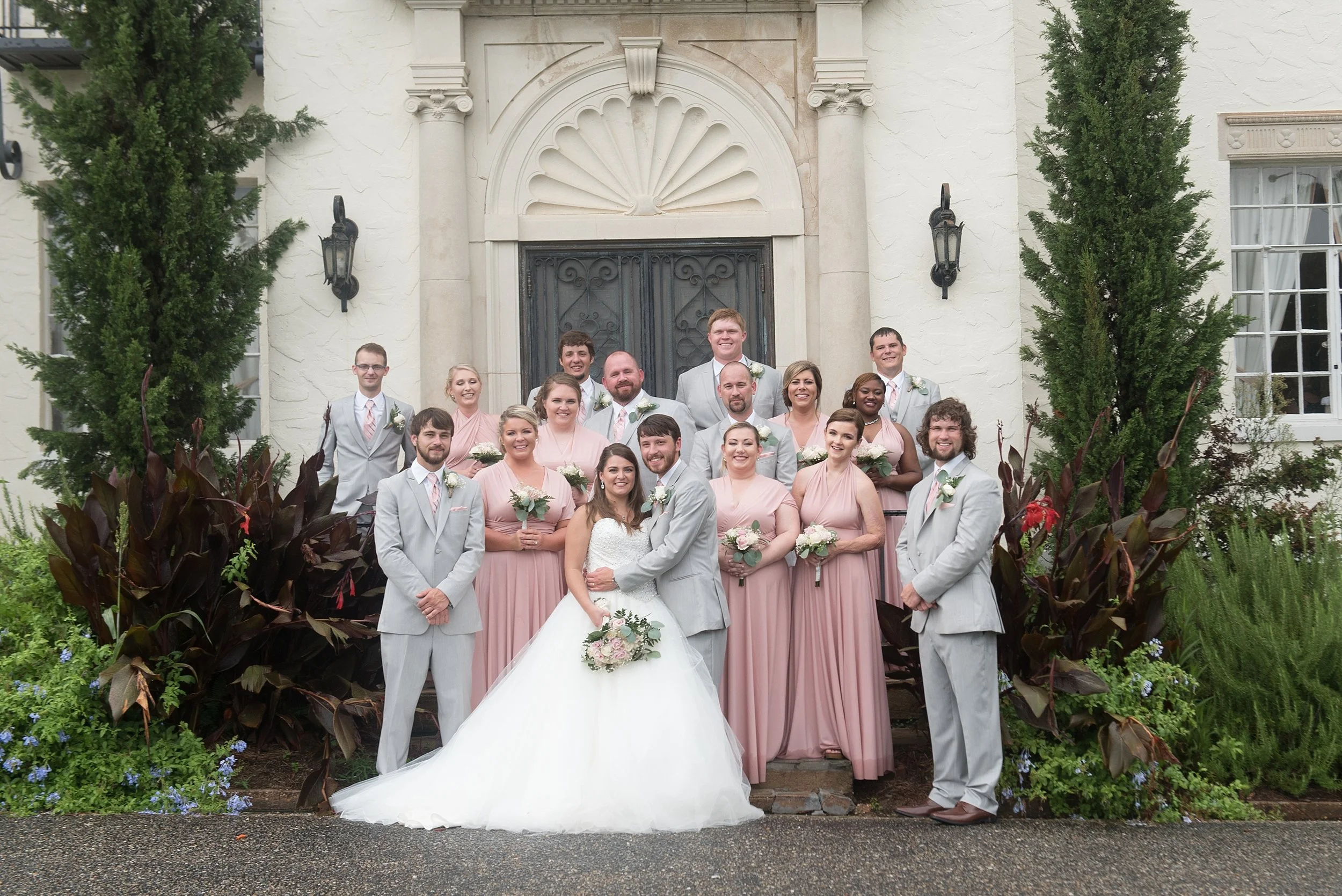 wedding party gathers on the steps of Springdale in Andalusia, Alabama