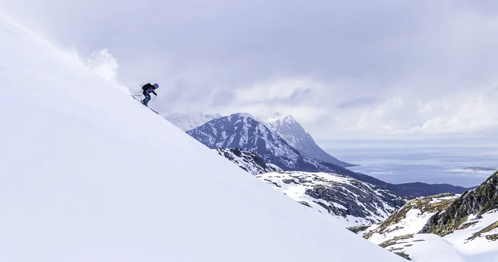 Sophie shredding down an isolated ridge