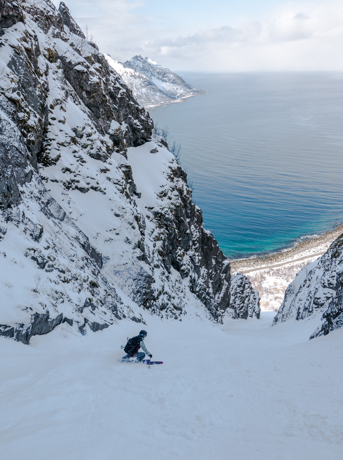 Soph skiing to the sea at Senja. Photo by: Pete Oswald