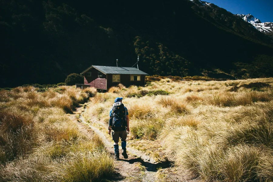 Ken approaching the Edwards Hut in the afternoon sun. Photo: Tom Powell