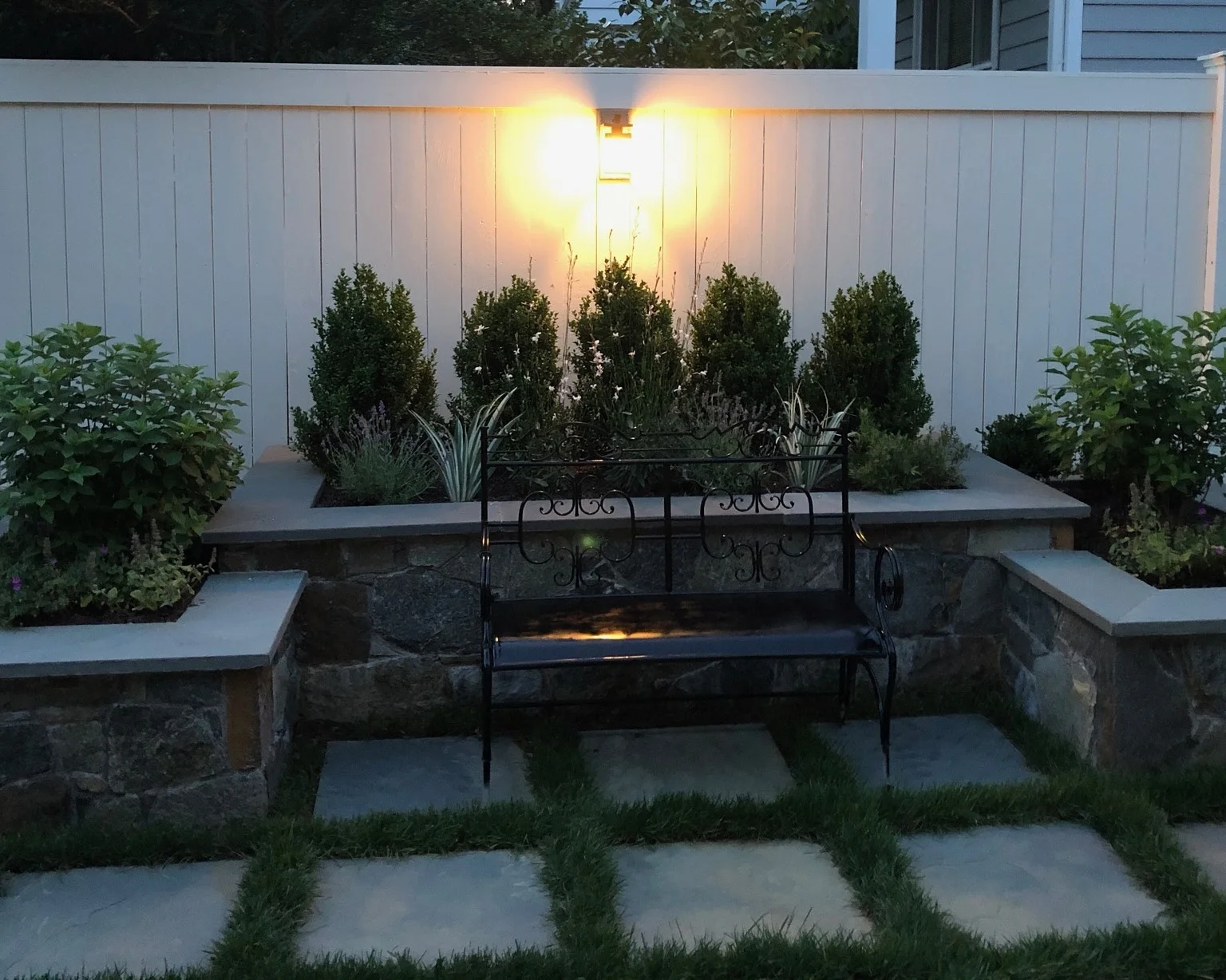   Stone planters, fence, and lighting   