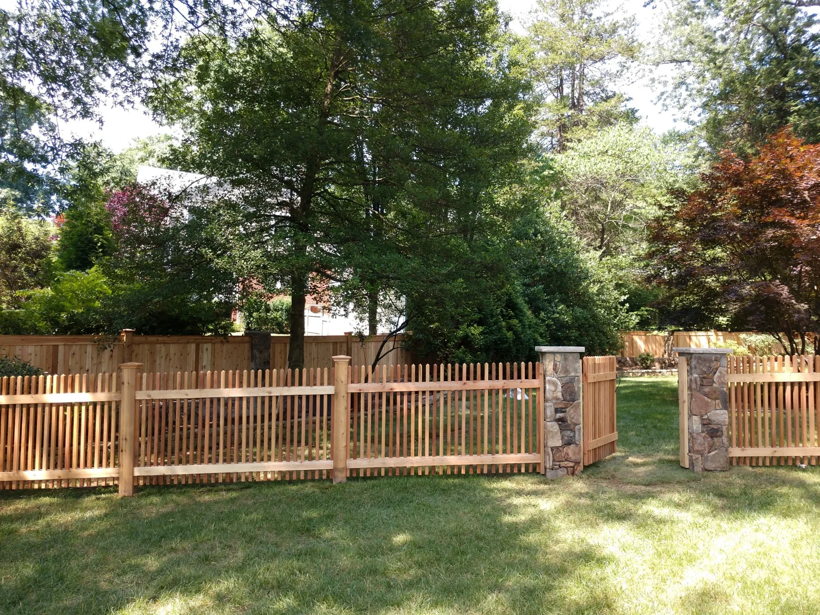  Stone and cedar fence.  