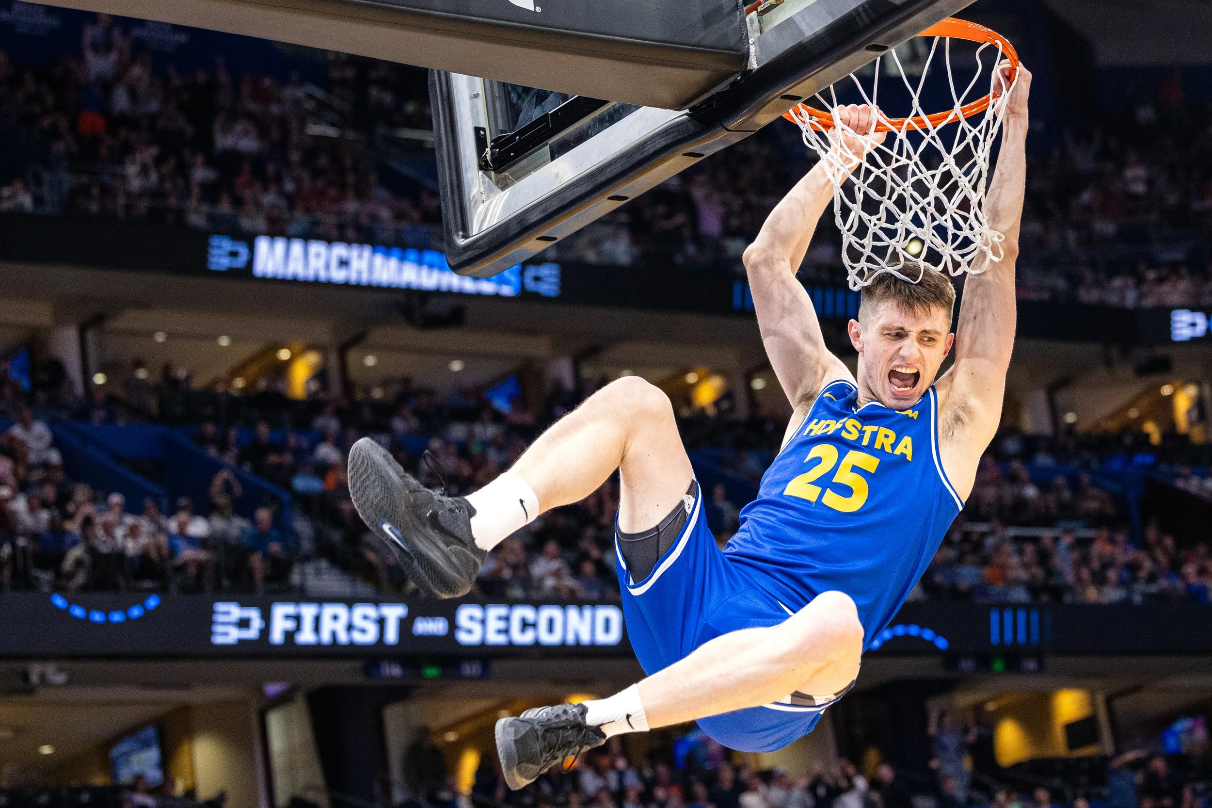  Hofstra University men’s basketball player German Plotnikov celebrates post-dunk during the NCAA First Round game against Alabama at Benchmark International Arena in Tampa, Fla. on March 30, 2026. This was Hofstra’s first NCAA Tournament appearance 