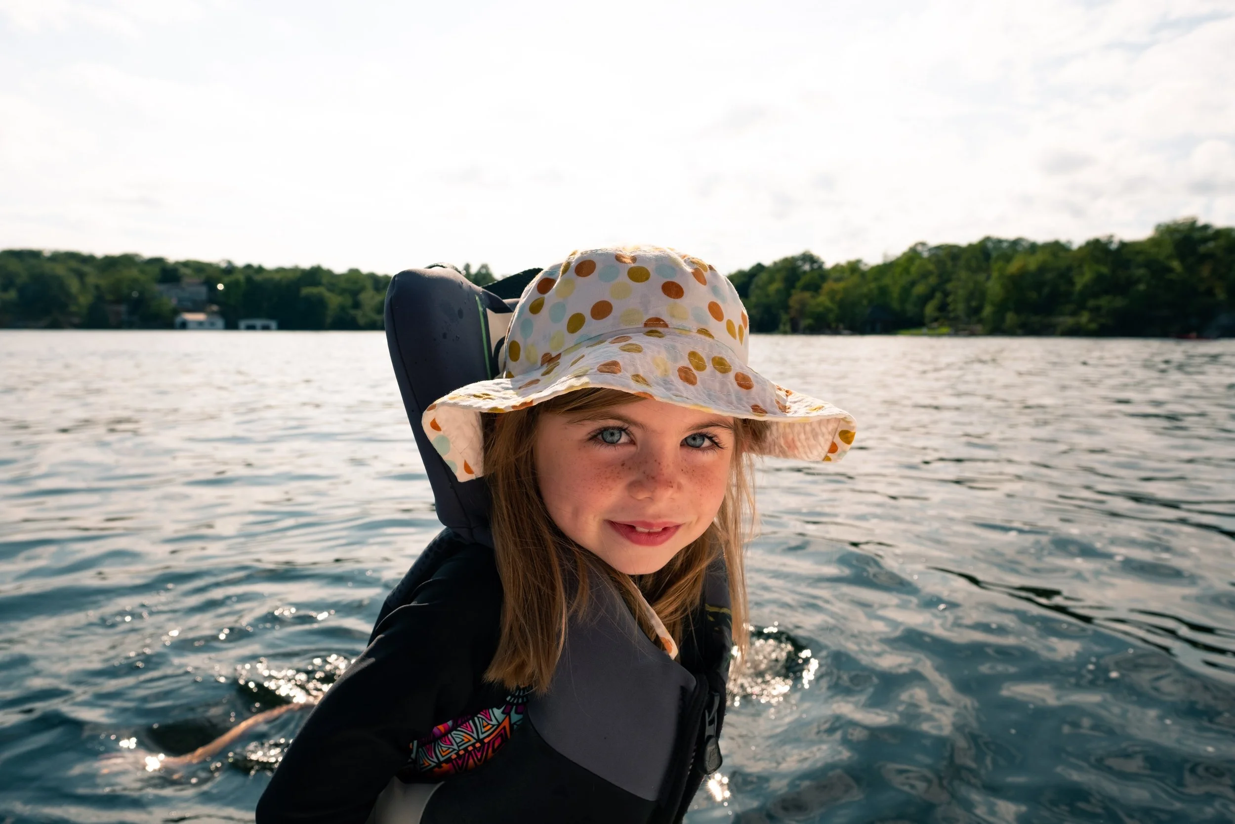 child-in-life-jacket-on-boat_4460x4460.jpg