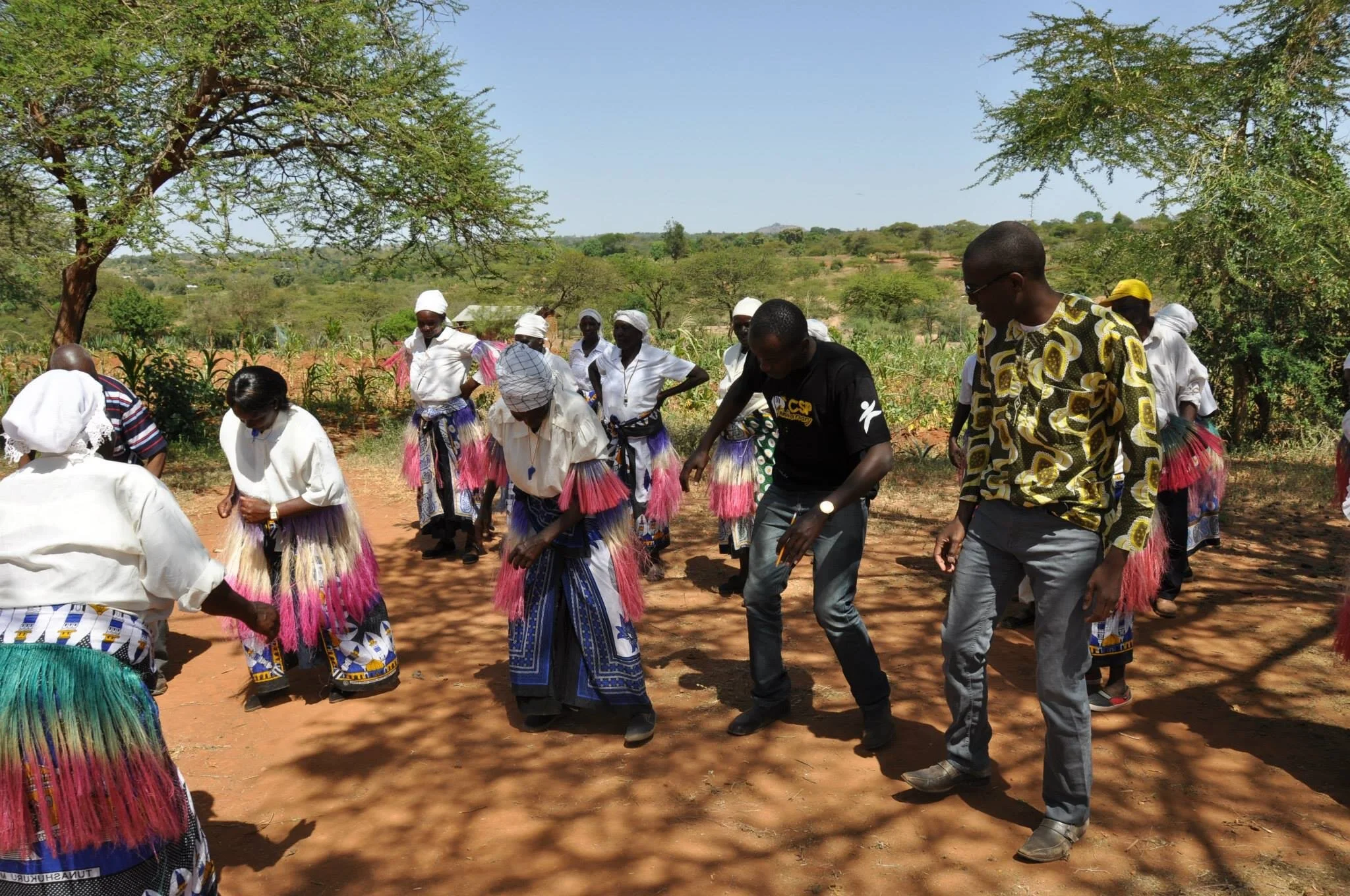 Okpebholo (far right) participating in Kenyan Rain Dance
