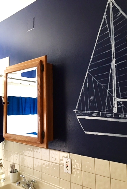 Kelsey's dad runs a marina and she's been sailing since she was a babe. The largesailboat is hand-stenciled.
