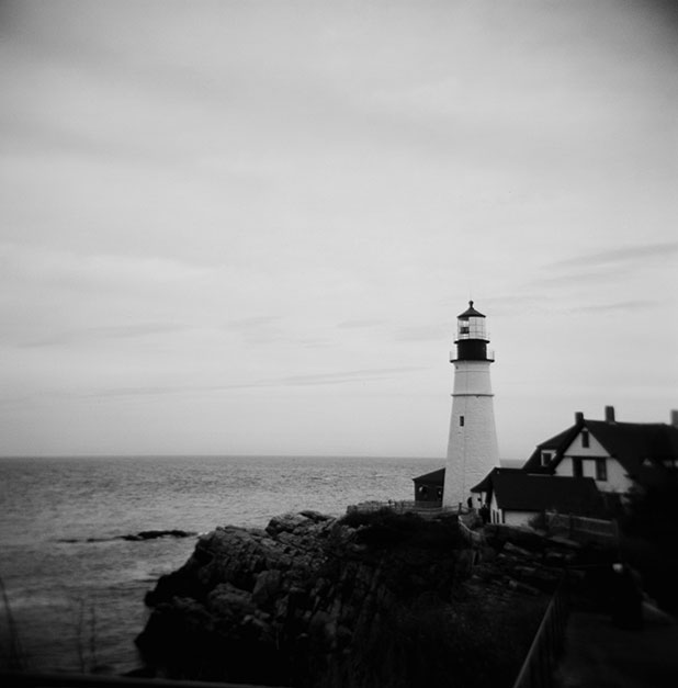 Film photo of a lighthouse, shot on a holga with black and white film, in Maine.