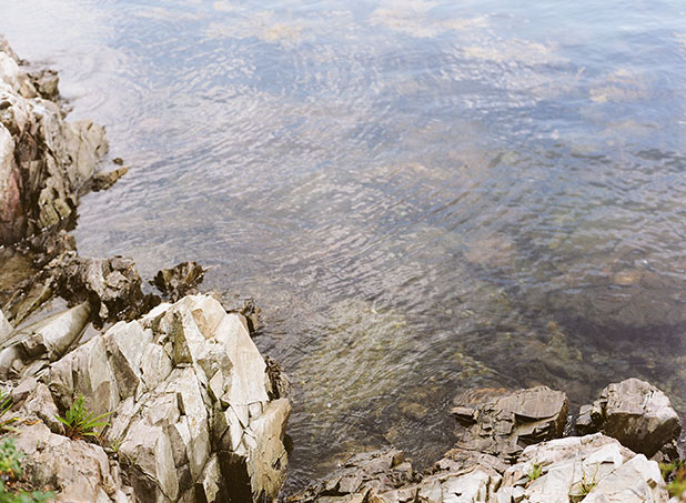 This is a photo of the water and rocky coast in New England, shot on color film.