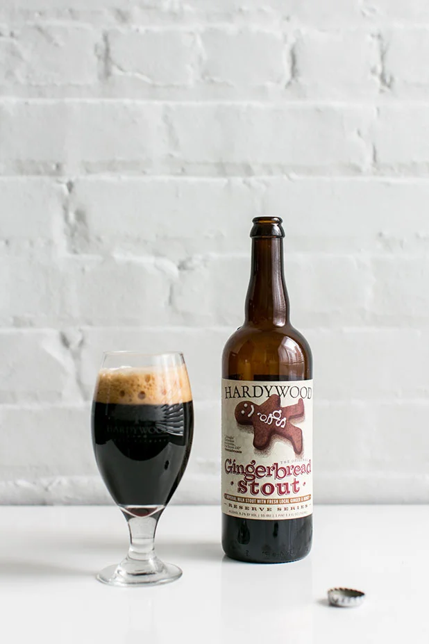Hardywood Brewery Gingerbread Stout photo against white brick with glass looking delicious.