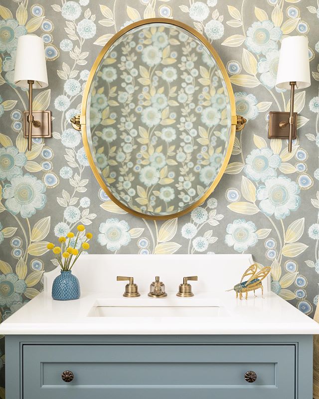 Powder rooms are such opportunities to have some fun!  I love how the gold tones of this wallpaper compliment the brass fixtures.

Custom Vanity: MMO Designs
Faucets, Mirror, and Sconces: @potterybarn 
Custom Countertop: @italmarblegranite 
Wallpaper