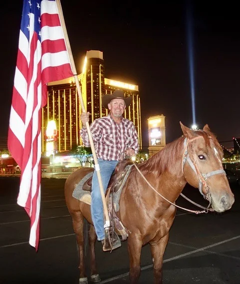 RAFAEL SARABIA SHOWED UP ON THE GRIEF-STRICKEN STRIP WITH HIS HORSE AND OLD GLORY. PHOTO: NORM CLARKE.