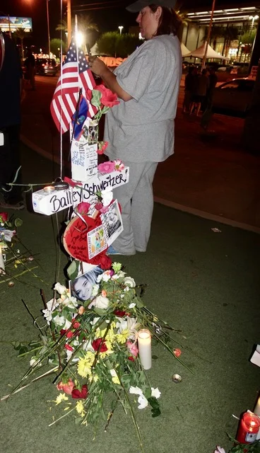 THOUSANDS GATHER AT LAS VEGAS SIGN TO PAY REPECTS TO THE FALLEN