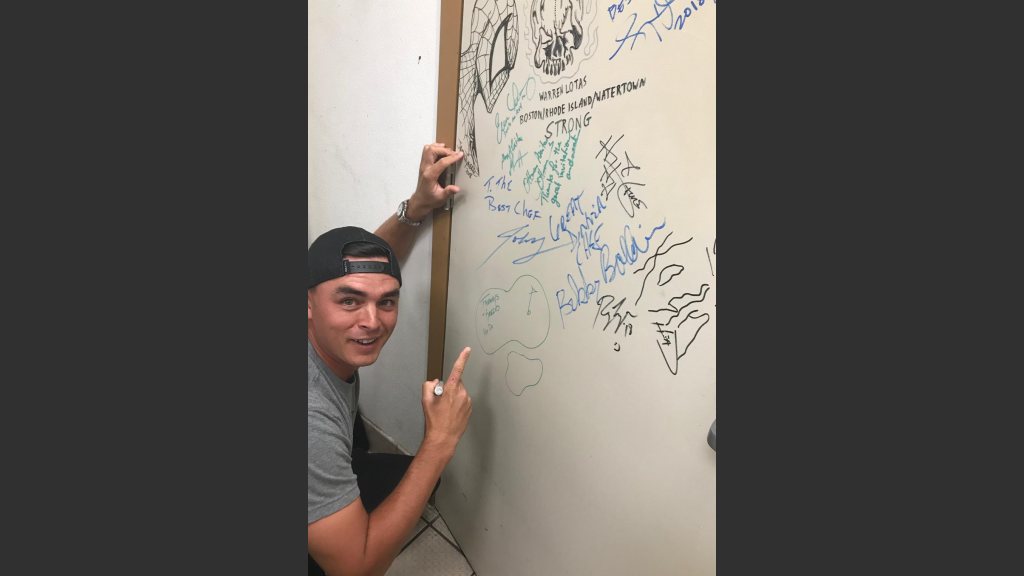 Rickie Fowler signs Chef Barry S. Dakake’s “Celebrity Shakedown Door” Courtesy Photo