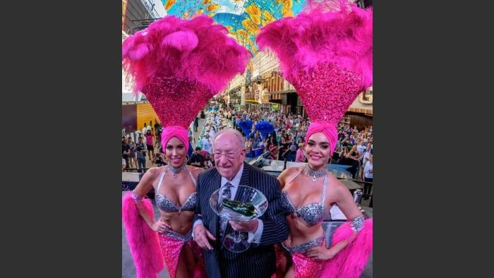 Hizzoner with his ubiquitous martini glass and showgirl sidekicks. Photo: Tom Donoghue