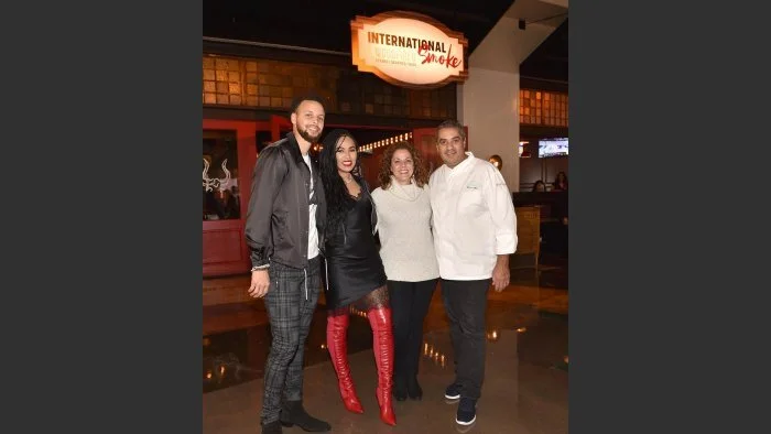 Four-time Grammy winner Drake and NBA great Stephen Curry, at the opening on Monday (Dec. 30) of International Smoke (MGM Grand), a collaboration of Curry’s wife, Ayesha, and San Francisco-based star chef Michael Mina. His wife, Diane, is third from…