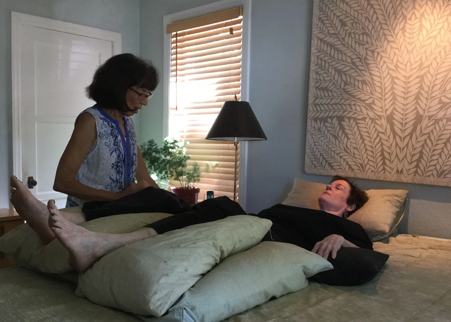 A client in yoga nidra, guided relaxation.