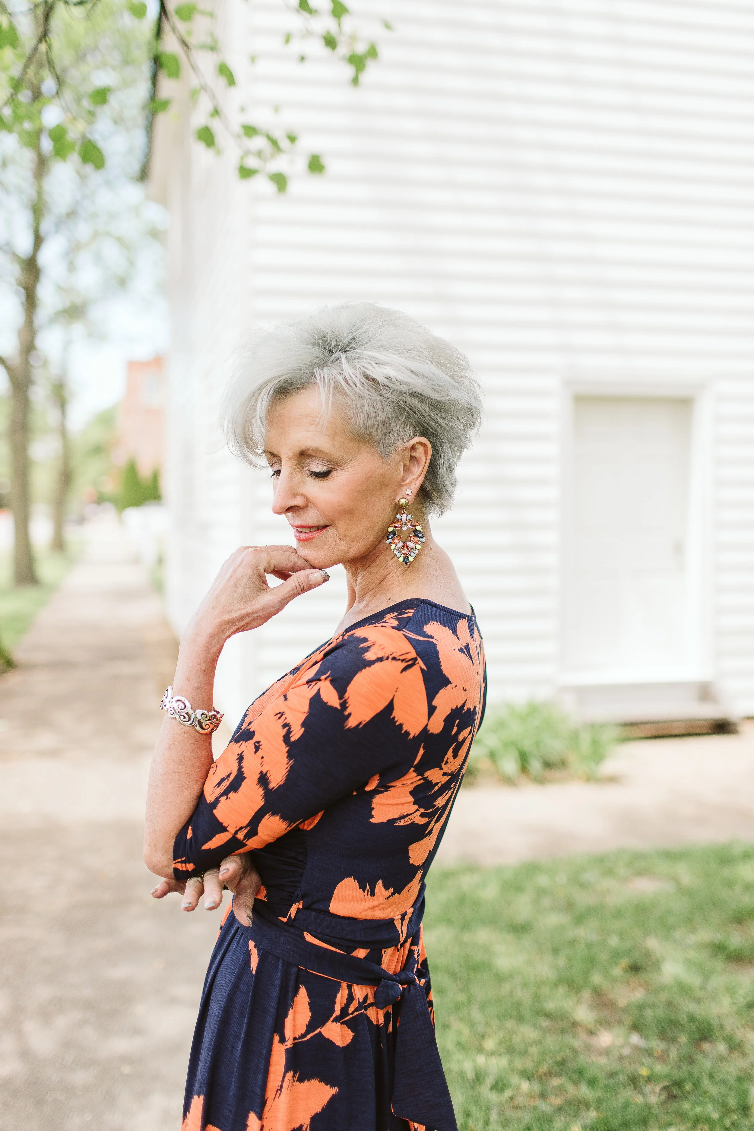 Vicki wears the Navy & Coral Floral Wrap Maxi from Simple Extravagance. $49.
